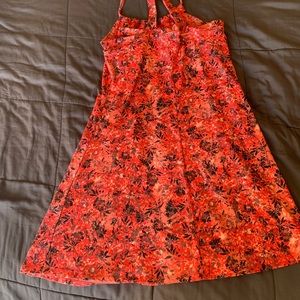 Orange sundress size L but runs a little small, it has a built in bra.